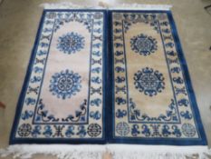 A pair of Chinese woollen rug, one blue