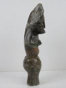 A soapstone fertility figurine standing