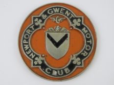 A rare vintage Newport & Gwent Motor Club car badge, painted in Newport County orange, 9.8cm dia.