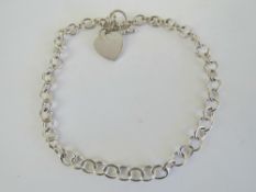 A substantial HM silver choker chain necklace having heart charm upon, T-bar clasp, hallmarked 925,