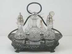 A large silver plated and cut glass crue