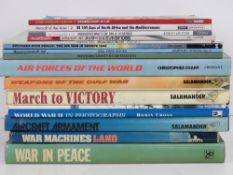 A quantity of assorted military themed b