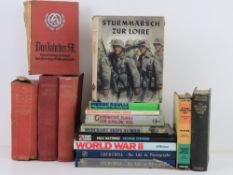 A quantity of assorted military themed b