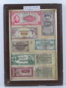 A framed montage of cWWII bank notes inc