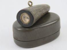 A WWII British SOE toggle button compass