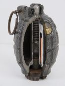 An inert WWI Mills No.36 grenade having