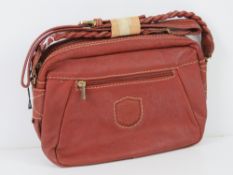 A vintage Italian made handbag in red, m