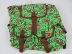 An owl pattern neon green ruck sack 'as