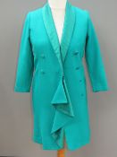 A green long length jacket, no apparent