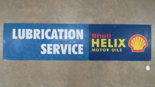 A vintage c1980s Shell Helix Motor Oils 'Lubrication Service' sign made on fibreboard and