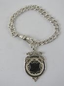 A HM silver Albert chain having clasp and medallion upon, hallmarked throughout, 19.9g.