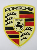 A contemporary cast metal 'Porsche' wall sign measuring 30 x 22.5cm.
