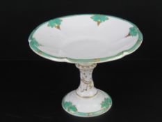 A good Davenport Longport cream ground and gilded footed tazza decorated with vine leaves upon, 29cm
