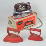 A pair of painted flat irons being No3 and No9 size, together with a Sumbeam Ironmaster electric