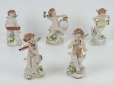 A set of five ceramic angelic musicians, Continental, each approx 12cm high, each with 'N' with