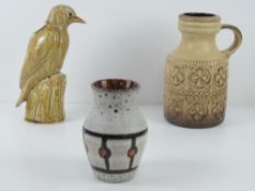 A West German pottery jug standing 23cm high, together with a West German pottery vase (slightly a/