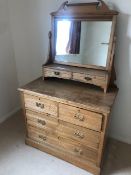 An Edwardian mirror top wash stand having twin jewellery drawers over two drawer and two door