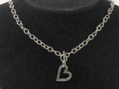 A HM silver necklace having heart pendant set with pink stone upon, T-bar clasp hallmarked 925, 40cm