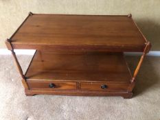 A contemporary mahogany coffee table having twin drawers to the base, 83 x 43 x 53cm.