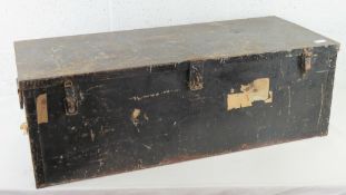 A metal travel trunk with clasp and end handles with original 'Cabin' label upon, 93 x 39 x 31cm.