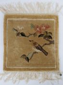 A hand knotted miniature prayer rug having bird and tree blossom upon, 32 x 30cm.