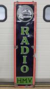 An original enamelled tin plate advertising sign 'His Masters Voice Radio' measuring 46 x 183cm.