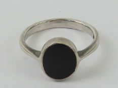A silver and onyx signet ring, unengraved, size K-L.
