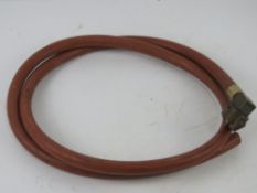 A WWII Vickers water hose with adapter.