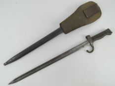 A WWI French 1892 pattern Mannlicher-Berthier bayonet with scabbard and frog.