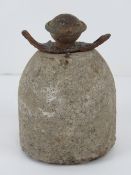 An inert WWII German concrete AP mine having egg grenade fuse.