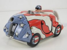 A Lorna Bailey teapot in the form of a racing car, 'USA 1' pattern,