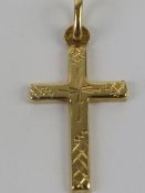 An 18ct gold crucifix, hallmarked 750, 3cm including bale, 1.1g.