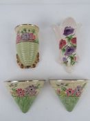 A quantity of assorted ceramic wall pockets;