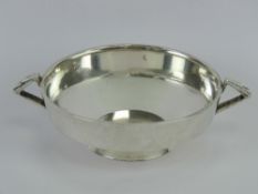 An Art Deco HM silver quaiche style single footed bowl having twin geometric side handles,