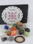 An Indian agra pierced and flattened plate together with a quantity of 'eggs' iincluding some