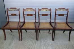 A set of four late 19thC rosewood dining chairs each with Berger seat support and having inlaid