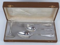 A German silver Christening set in original fitted box comprising fork, spoon, teaspoon and pusher,
