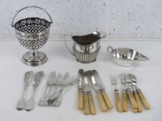A small quantity of silver plated items inc sauce boat, milk jug, bon bon dish with swing handle,