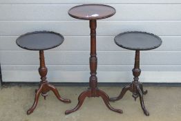 A matched pair of Edwardian wine tables each having turned stem of triform base, 33cm dia,