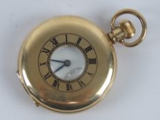 A gold plated top wind full Hunter pocket watch having viewing pane with black enamel chapter ring