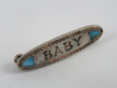 An enamelled Charles Horner 'Baby' Art Nouveau silver brooch,