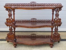 A fine 19thC walnut three tier open fronted buffet or credenza having shaped shelves in fine