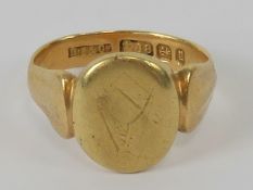 Freemasonry; An 18ct gold signet ring having square and compasses symbol upon,