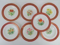 A rare set of 19thC Minton botanical cabinet plates having gilded and dark pink border each having