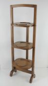 A c1930s oak folding cake / plate stand.