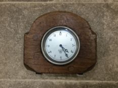 A laminated mahogany propellor boss with centre mounted Smiths clock.