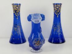 A pair of Bristol Blue glass conical vases having hand painted gilt floral decoration throughout