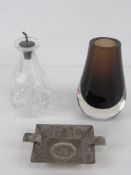 An HM silver oil pouring top with original cork in cut glass bottle.