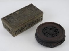 A carved Oriental hardwood pot stand having central dragon design, 114cm dia at widest,