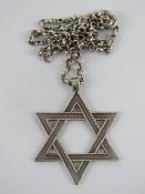 A large HM silver Star of David pendant on white metal chain, pendant 4.8cm inc bale, 17.3g.